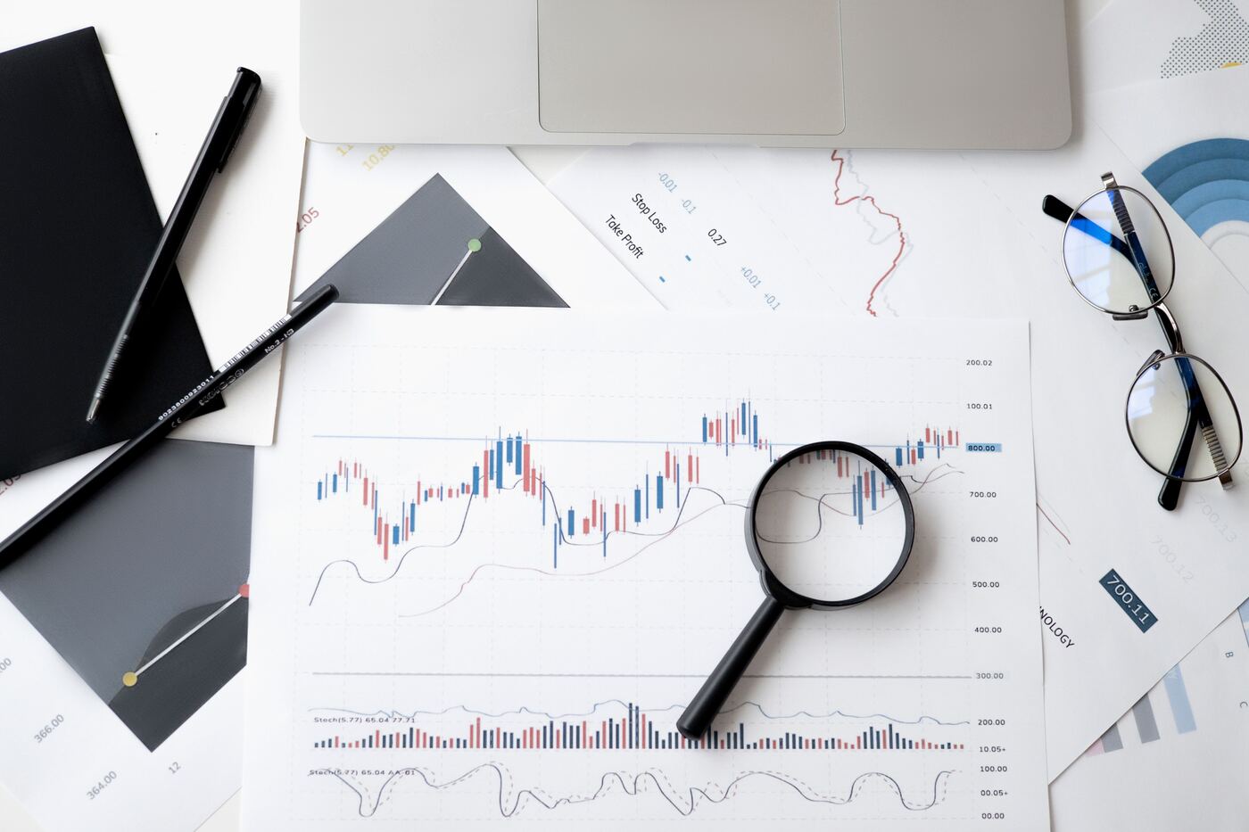 Financial charts and earnings analysis on a desk